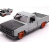 JADA TOYS JADA33610 CHEVROLET C-10 PICK UP 1985 TOYO TIRES GREY/BLACK 1:24 Modellino