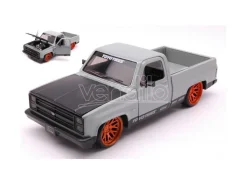 JADA TOYS JADA33610 CHEVROLET C-10 PICK UP 1985 TOYO TIRES GREY/BLACK 1:24 Modellino